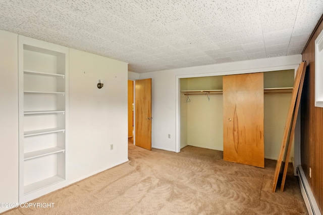 7101 Omalley Rd, Anchorage, AK 99507 - unfurnished bedroom with a baseboard radiator, carpet, and a closet