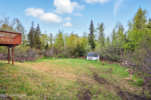 7101 Omalley Rd, Anchorage, AK 99507 - view of grassy yard with a deck