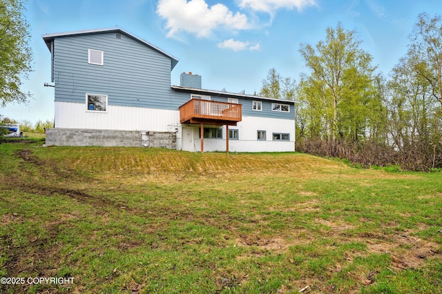 7101 Omalley Rd, Anchorage, AK 99507 - rear view of property featuring a deck, a yard, and a chimney
