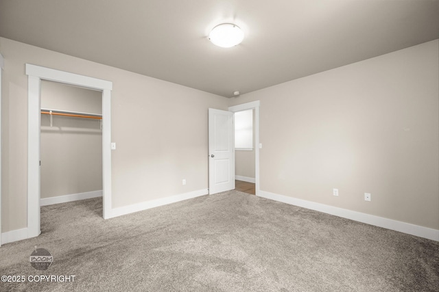 12248 Vista Ridge Loop # 30, Eagle River, AK 99577 - unfurnished bedroom featuring carpet floors, a spacious closet, and a closet