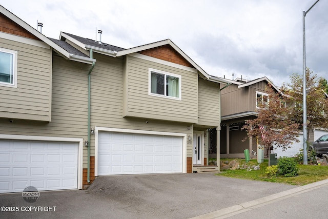 12248 Vista Ridge Loop # 30, Eagle River, AK 99577 - view of property with driveway and a garage