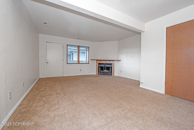 4063 E 20th Ave Unit D54, Anchorage, AK 99508 - unfurnished living room featuring carpet flooring, a fireplace, and baseboards