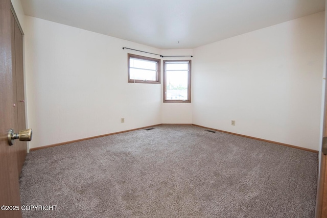 4063 E 20th Ave Unit D54, Anchorage, AK 99508 - unfurnished room featuring carpet flooring and baseboards