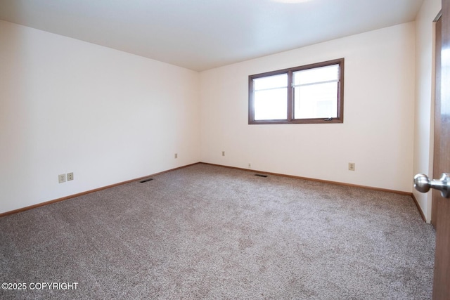 4063 E 20th Ave Unit D54, Anchorage, AK 99508 - spare room with carpet flooring and baseboards