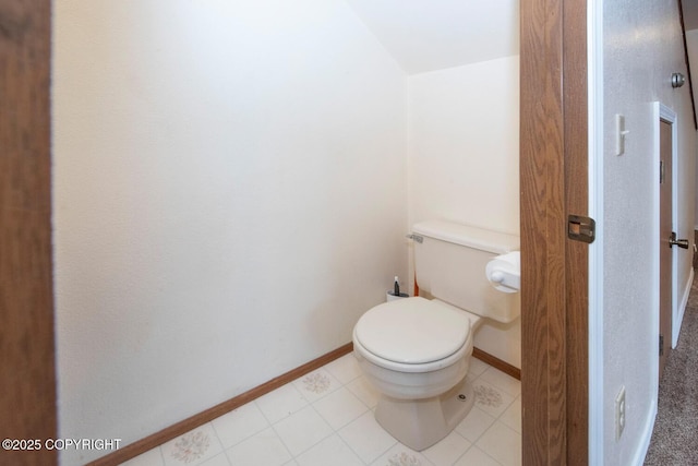 4063 E 20th Ave Unit D54, Anchorage, AK 99508 - bathroom featuring toilet and baseboards