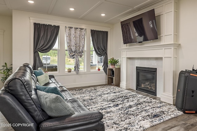 5233 W Jaxton Cir, Wasilla, AK 99623 - living room with wood finished floors, recessed lighting, baseboards, and a tiled fireplace