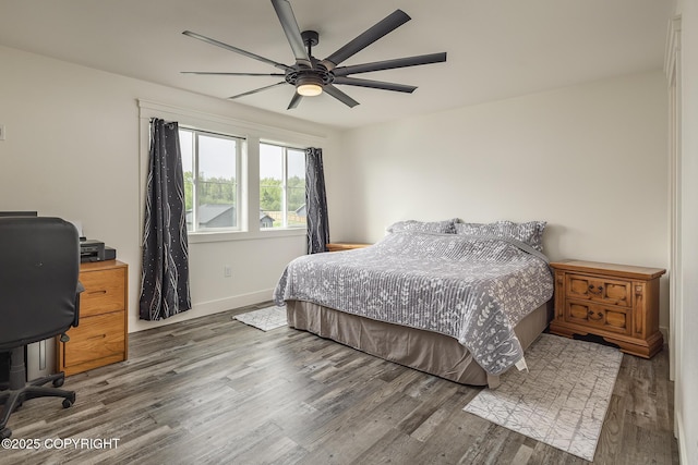 5233 W Jaxton Cir, Wasilla, AK 99623 - bedroom featuring wood finished floors, an office area, baseboards, and ceiling fan