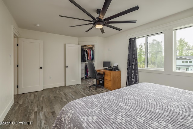 5233 W Jaxton Cir, Wasilla, AK 99623 - bedroom with wood finished floors, baseboards, a spacious closet, and a closet
