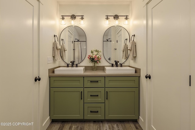 5233 W Jaxton Cir, Wasilla, AK 99623 - full bath featuring double vanity, wood finished floors, baseboards, and a shower