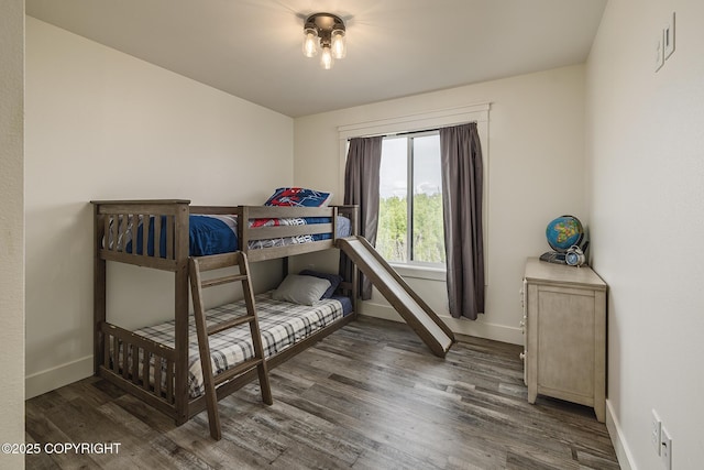5233 W Jaxton Cir, Wasilla, AK 99623 - bedroom featuring baseboards and wood finished floors