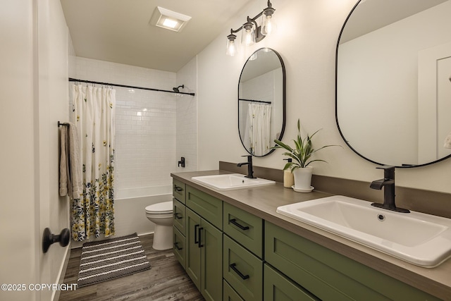 5233 W Jaxton Cir, Wasilla, AK 99623 - bathroom with double vanity, toilet, shower / tub combo, and wood finished floors