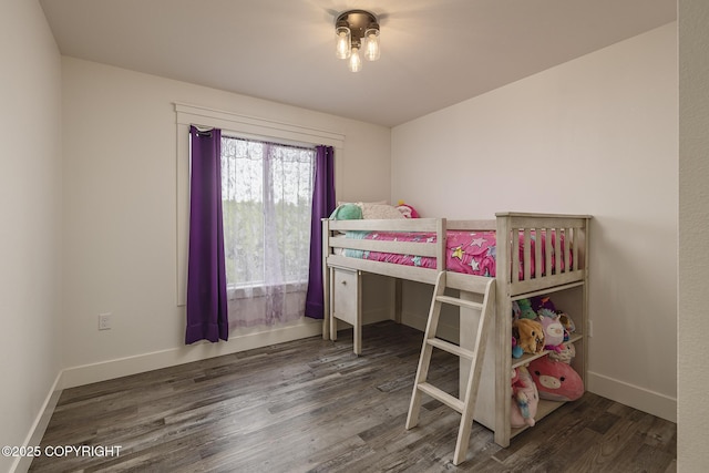 5233 W Jaxton Cir, Wasilla, AK 99623 - bedroom with wood finished floors and baseboards