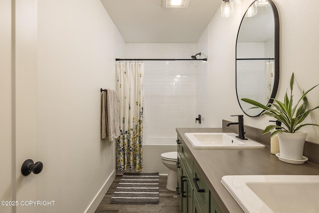 5233 W Jaxton Cir, Wasilla, AK 99623 - full bath with double vanity, wood finished floors, shower / tub combo, toilet, and baseboards