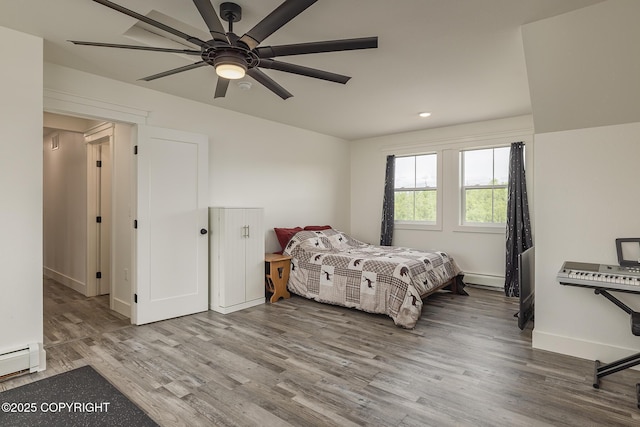 5233 W Jaxton Cir, Wasilla, AK 99623 - bedroom with wood finished floors, baseboard heating, baseboards, recessed lighting, and a ceiling fan