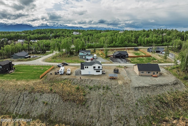 5233 W Jaxton Cir, Wasilla, AK 99623 - aerial view of a mountain backdrop and a heavily wooded area