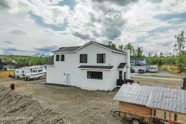 5233 W Jaxton Cir, Wasilla, AK 99623 - rear view of house with a shingled roof