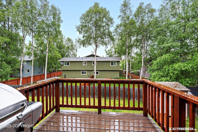 3529 W 41st Ave, Anchorage, AK 99517 - wooden terrace with a fenced backyard