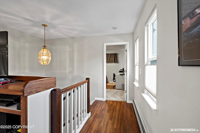 3529 W 41st Ave, Anchorage, AK 99517 - hallway with dark wood finished floors, a baseboard radiator, and baseboards