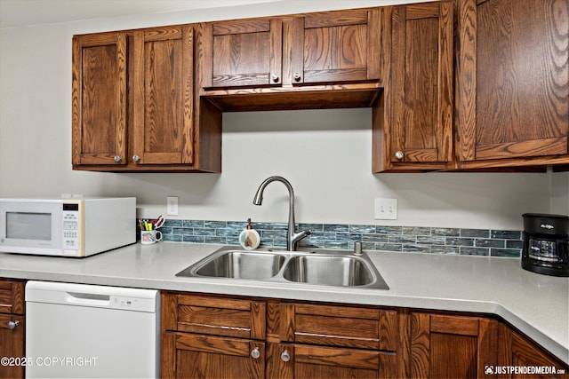 3529 W 41st Ave, Anchorage, AK 99517 - kitchen featuring white appliances, a sink, and light countertops