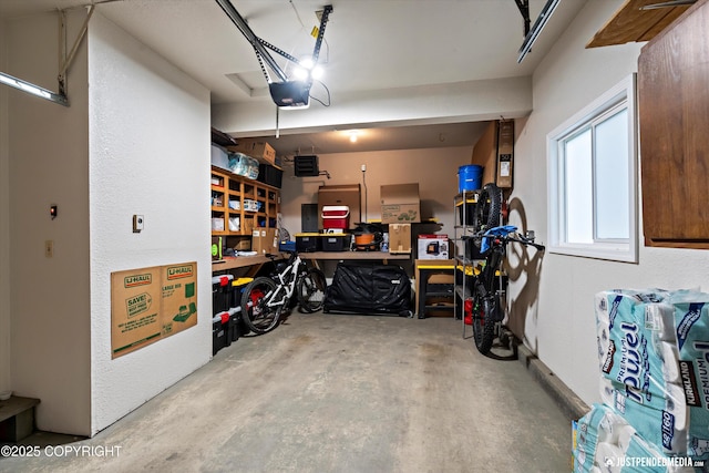 3529 W 41st Ave, Anchorage, AK 99517 - garage featuring a garage door opener and a workshop area