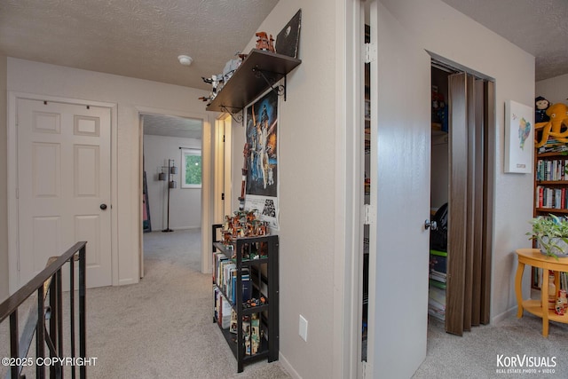 767 N Yakima St, Wasilla, AK 99654 - hallway with carpet flooring and a textured ceiling