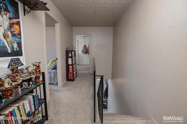 767 N Yakima St, Wasilla, AK 99654 - corridor with carpet flooring, a textured ceiling, a textured wall, and an upstairs landing