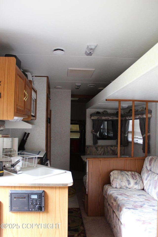 63760 Elizabeth Ave, Ninilchik, AK 99639 - kitchen with a sink and brown cabinetry