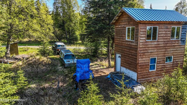 63760 Elizabeth Ave, Ninilchik, AK 99639 - view of property exterior featuring metal roof and an outbuilding