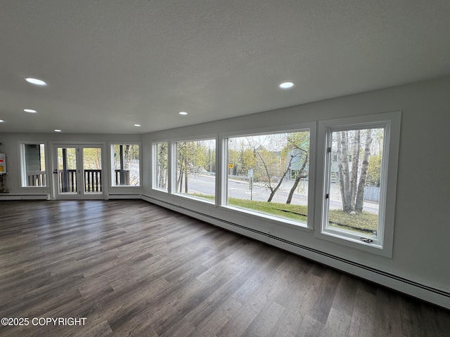 1430 Bridgeway St # 3, Anchorage, AK 99501 - unfurnished sunroom with a baseboard radiator and plenty of natural light