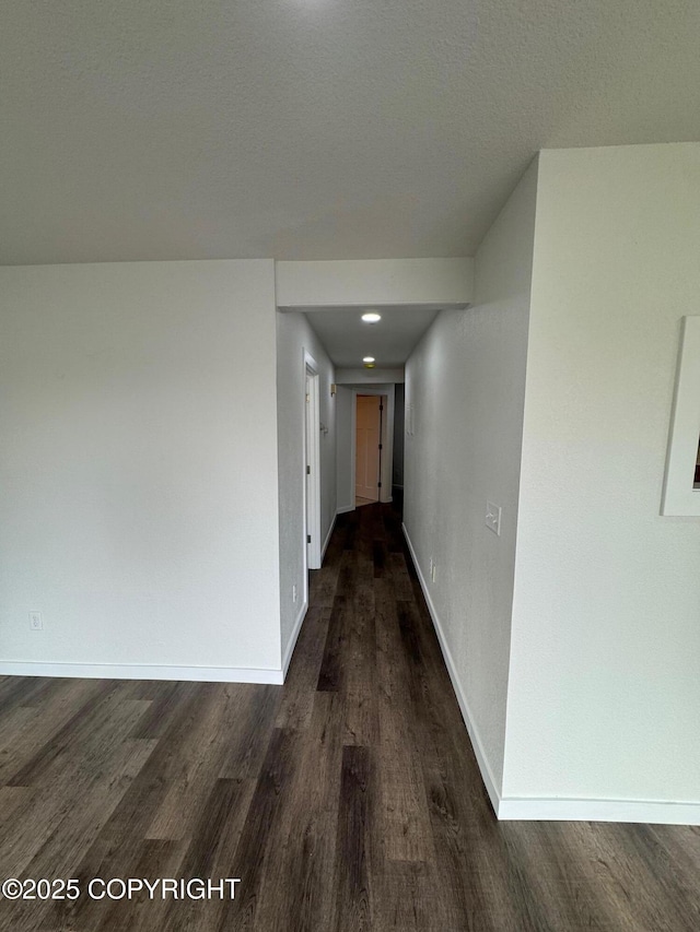 1430 Bridgeway St # 3, Anchorage, AK 99501 - hallway with dark wood-style floors and baseboards