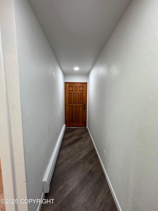 1430 Bridgeway St # 3, Anchorage, AK 99501 - hallway with baseboard heating, dark wood-type flooring, baseboards, and recessed lighting