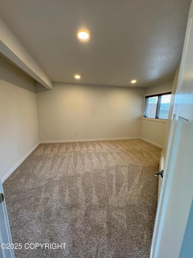 1430 Bridgeway St # 3, Anchorage, AK 99501 - basement with carpet floors, recessed lighting, and baseboards