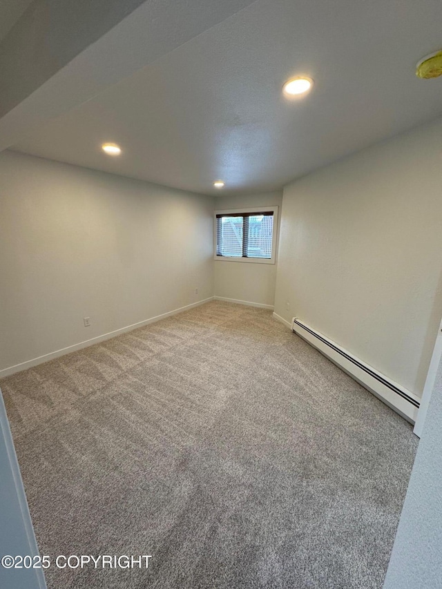 1430 Bridgeway St # 3, Anchorage, AK 99501 - spare room with a baseboard radiator, carpet floors, recessed lighting, and baseboards