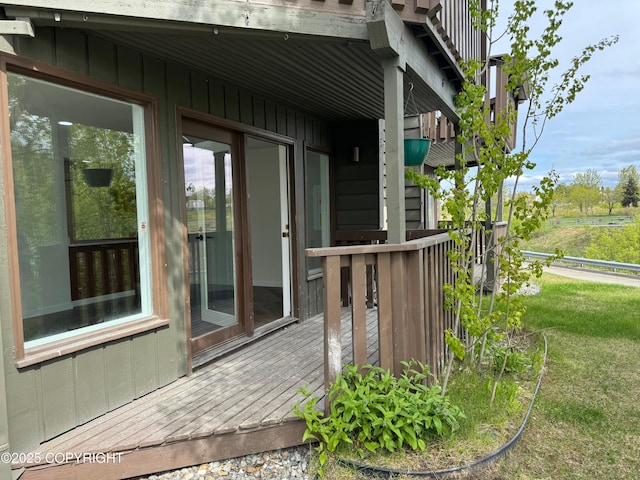 1430 Bridgeway St # 3, Anchorage, AK 99501 - view of side of home featuring a wooden deck and a yard