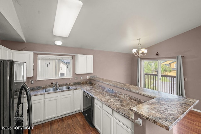 3933 Sycamore Loop, Anchorage, AK 99504 - kitchen featuring freestanding refrigerator, a sink, dishwasher, a peninsula, and dark wood-style flooring