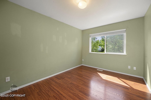 3933 Sycamore Loop, Anchorage, AK 99504 - unfurnished room with wood finished floors and baseboards