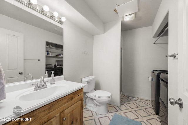 3933 Sycamore Loop, Anchorage, AK 99504 - full bathroom featuring toilet, vanity, and a shower with door