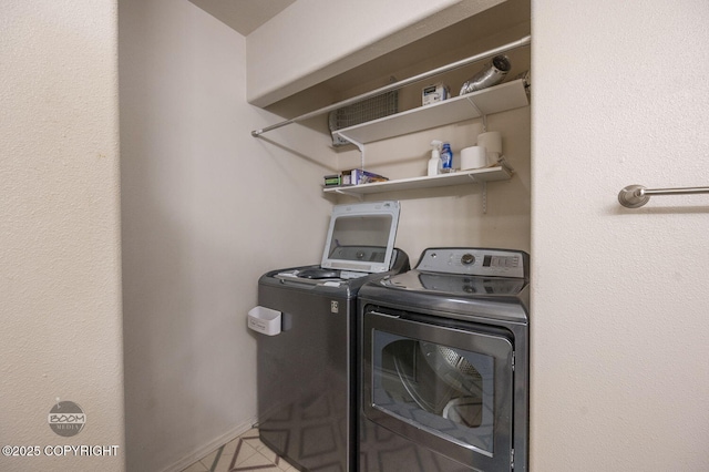 3933 Sycamore Loop, Anchorage, AK 99504 - laundry area with separate washer and dryer and baseboards