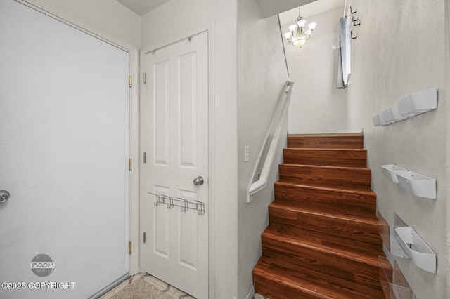 3933 Sycamore Loop, Anchorage, AK 99504 - stairway featuring a chandelier