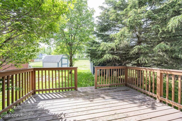 3933 Sycamore Loop, Anchorage, AK 99504 - deck featuring a lawn