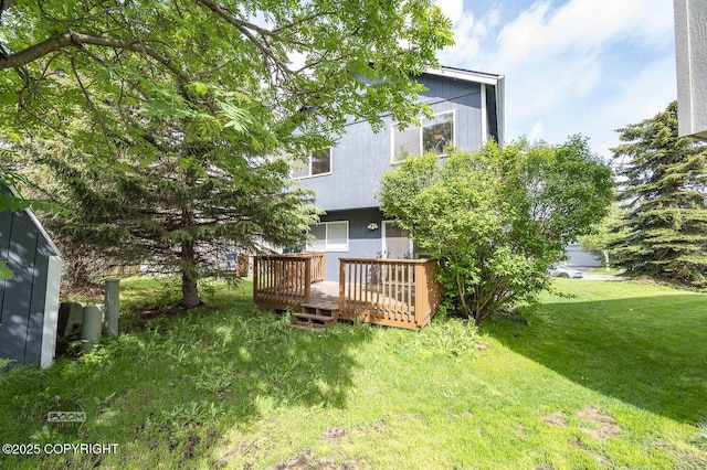 3933 Sycamore Loop, Anchorage, AK 99504 - view of grassy yard featuring a wooden deck