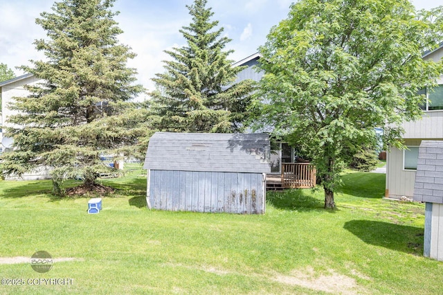 3933 Sycamore Loop, Anchorage, AK 99504 - view of green lawn featuring a wooden deck