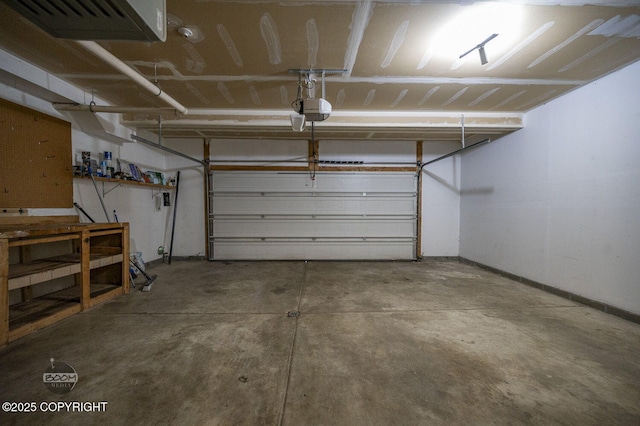 3933 Sycamore Loop, Anchorage, AK 99504 - garage featuring a garage door opener and baseboards