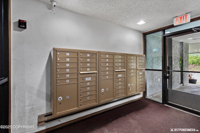 4433 San Ernesto Ave # 104, Anchorage, AK 99508 - surrounding community featuring a textured ceiling, mail area, and floor to ceiling windows
