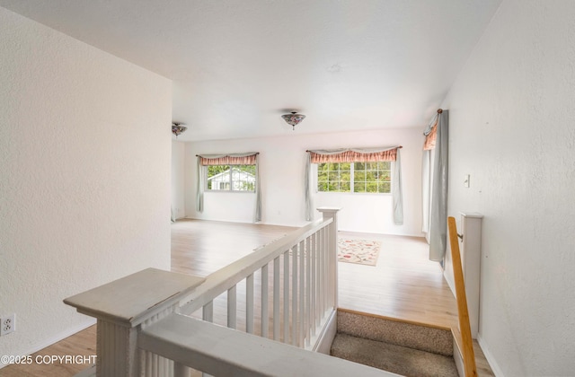 701 Buren Rd, Ketchikan, AK 99901 - staircase featuring a textured wall, wood finished floors, and baseboards