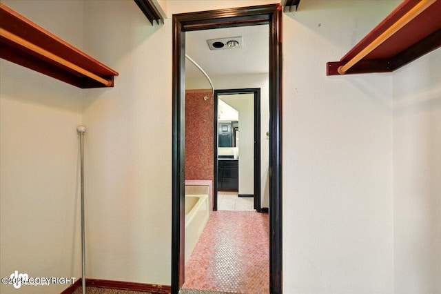 4821 S Outrigger Dr, Wasilla, AK 99654 - spacious closet featuring tile patterned flooring