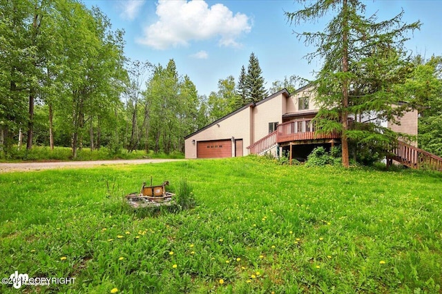 4821 S Outrigger Dr, Wasilla, AK 99654 - view of yard with stairs, a fire pit, and a deck