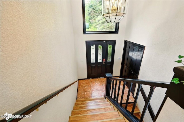 4821 S Outrigger Dr, Wasilla, AK 99654 - foyer with a textured wall, stairs, and light wood-style floors