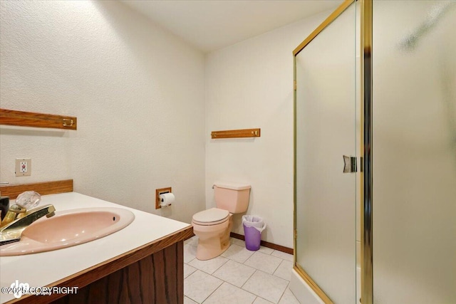 4821 S Outrigger Dr, Wasilla, AK 99654 - bathroom with a stall shower, tile patterned floors, toilet, and vanity