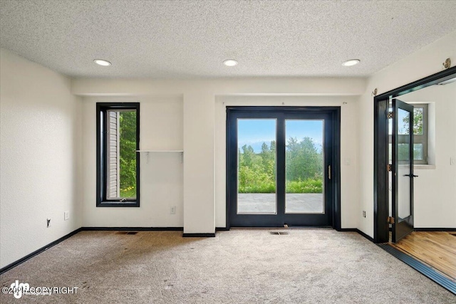 4821 S Outrigger Dr, Wasilla, AK 99654 - empty room featuring carpet, a textured ceiling, baseboards, and recessed lighting